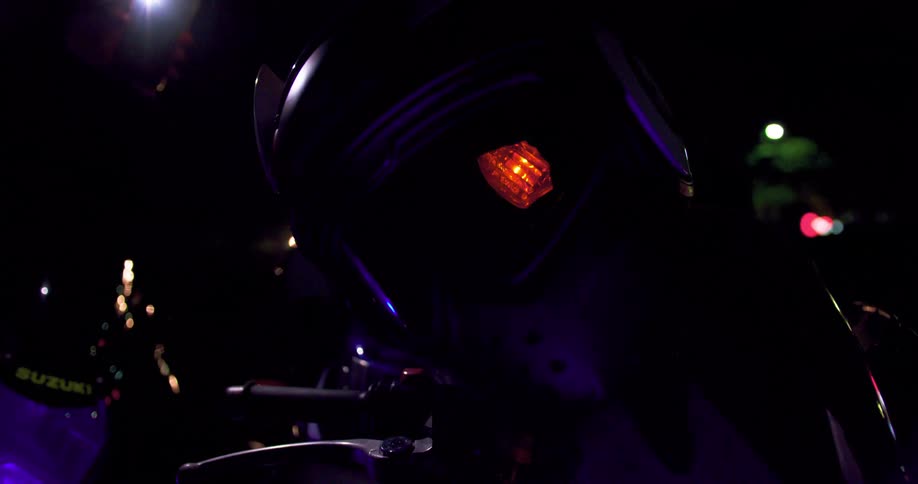 A helmet placed over a flashing motorcycle turn signal