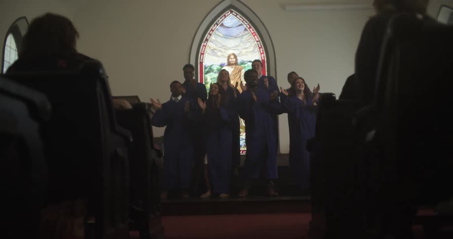 A choir sings in the church as the parishioners watch