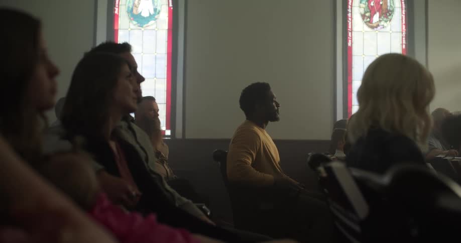 A man walks into church and sits in a pew