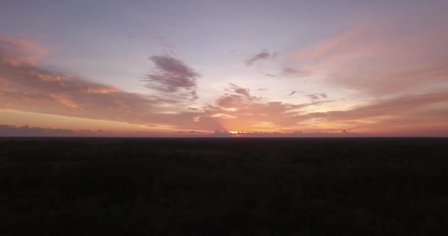 The sun sets over the horizon