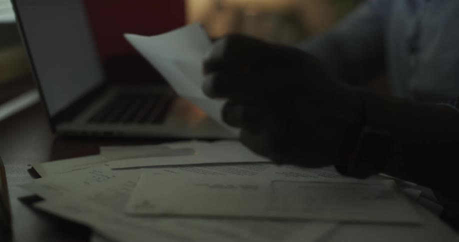 A man is typing on a laptop