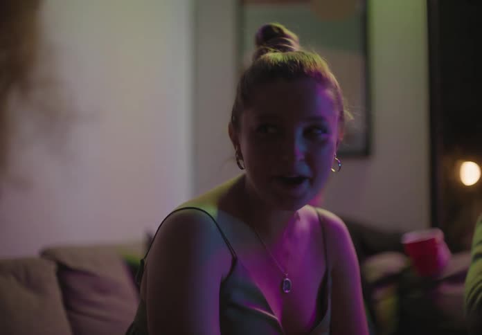 A woman sitting at a party and talking