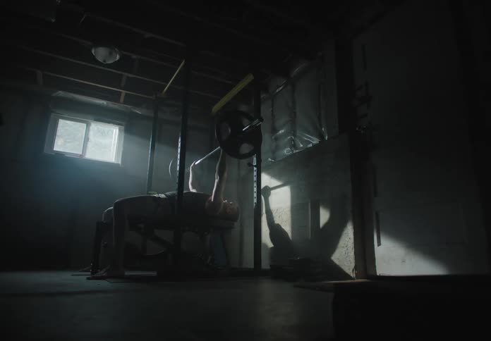 The man works out on the equipment
