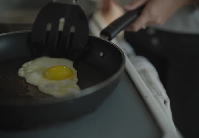 The egg cooks in the skillet