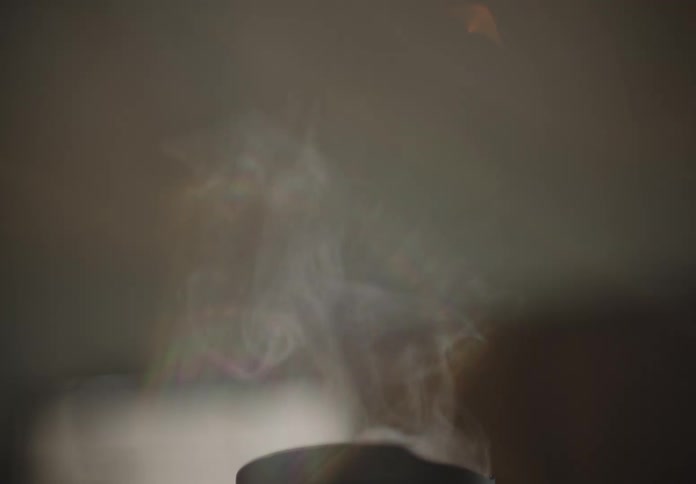 A cup with smoke coming from it