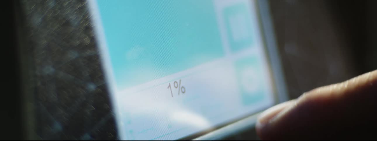A finger taps printing options on the screen of a 3d printer