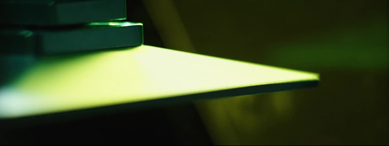 A piece of metal being lifted into the air