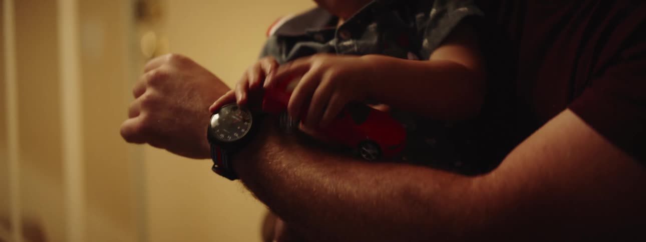 A father plays with his infant son