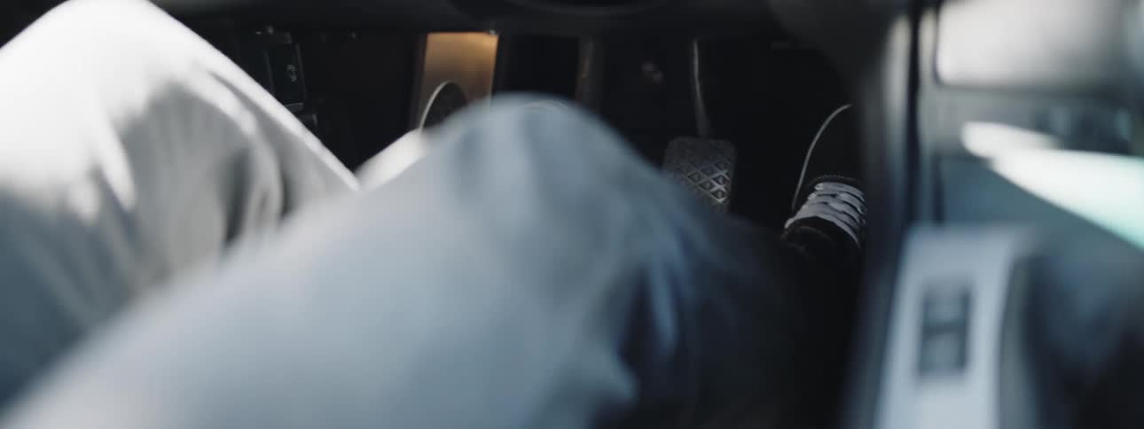 The person shifts the vehicle