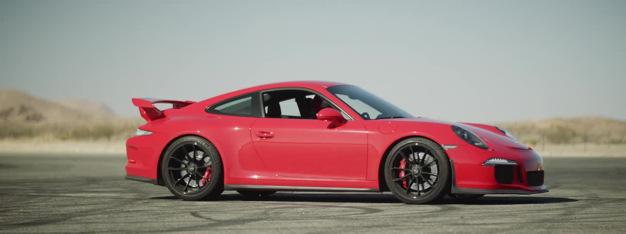A red sports car parked on a track