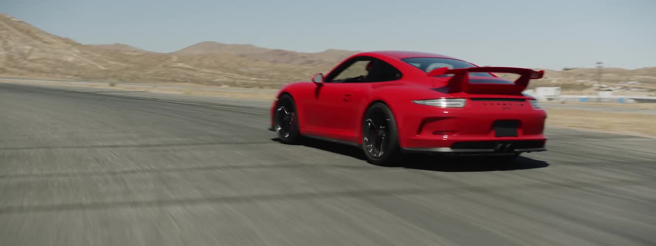 A person races a car around a track
