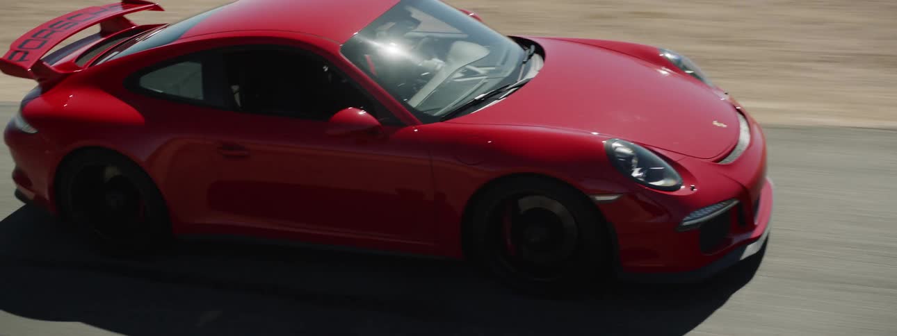 A person races their car on a track