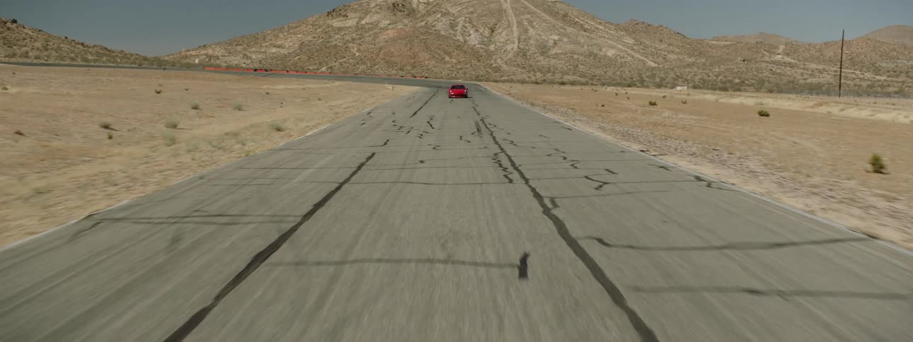 A person is driving a car down a road
