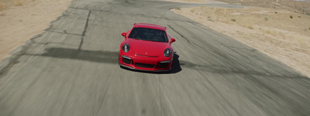 A red car races on the track