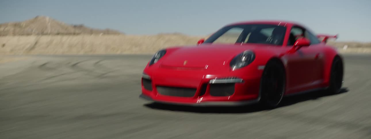 A person is driving a sports car