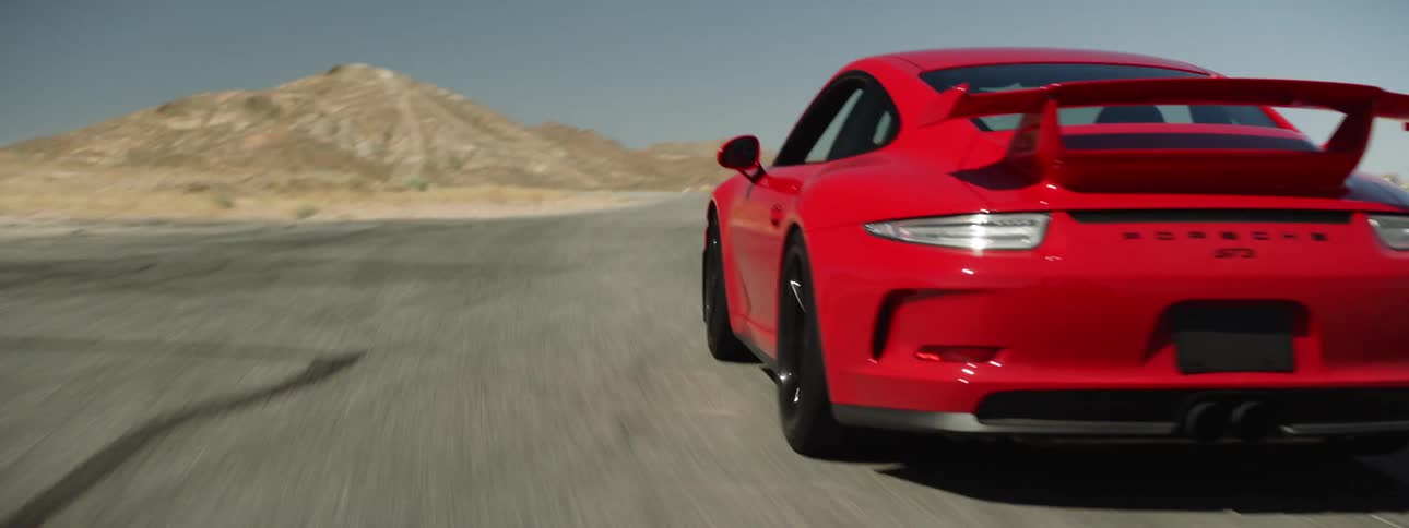 A red sports car driving on a track