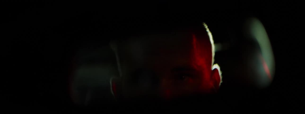 A white male drives a car being pursued by police officers