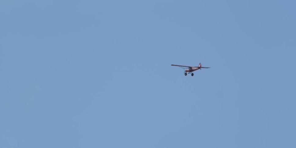 A small plane in a clear blue sky
