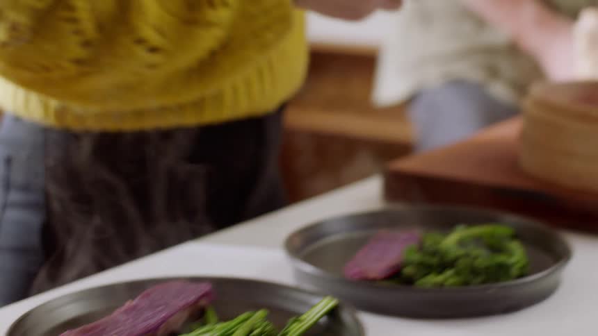 The woman serves the food