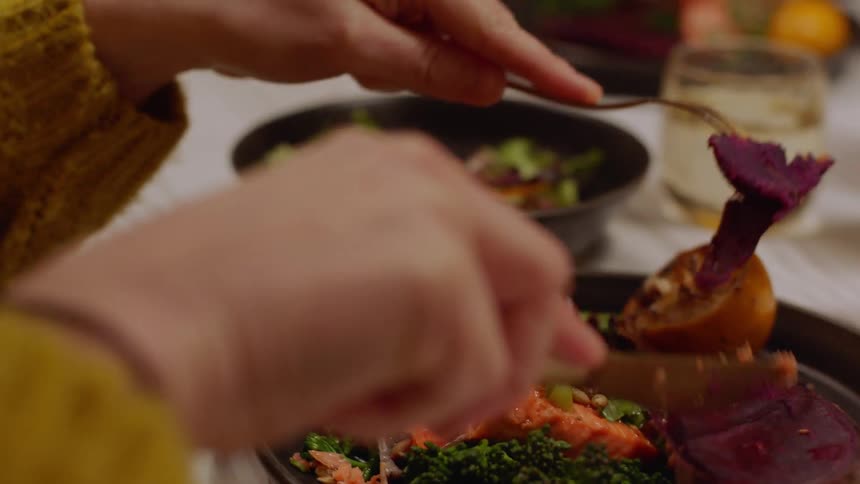 A man and woman eating a meal