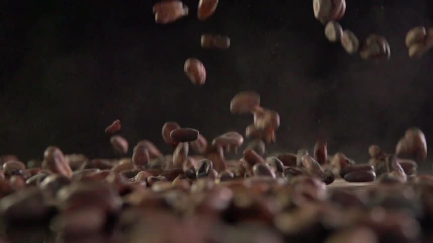 Coffee beans fall during a photo shoot