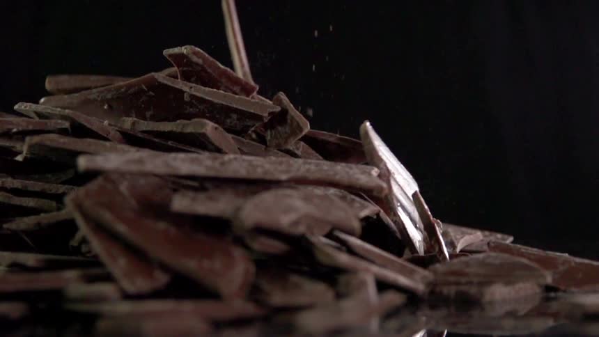 Pieces of chocolate fall inside for a photo shoot