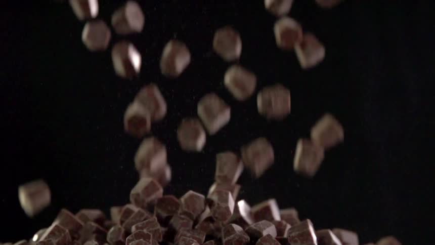Pieces of chocolate fall into a pile