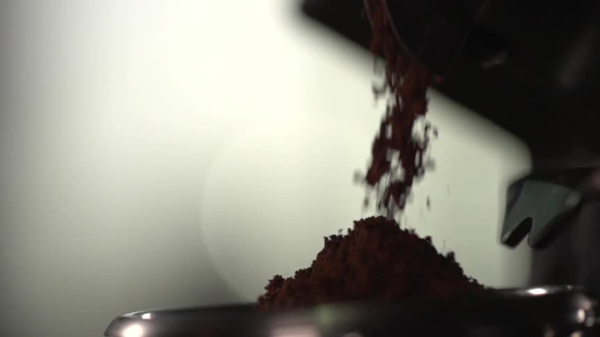 A ground up substance is falling into a pile