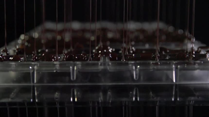 Chocolate being poured into plastic molds