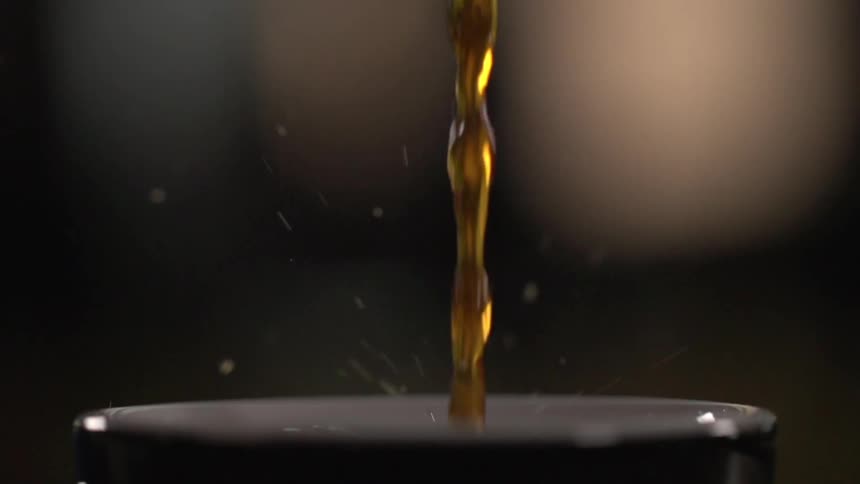 Coffee being poured into a coffee mug