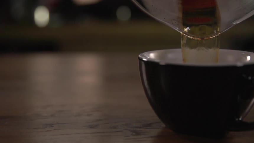 Coffee being poured into a cup