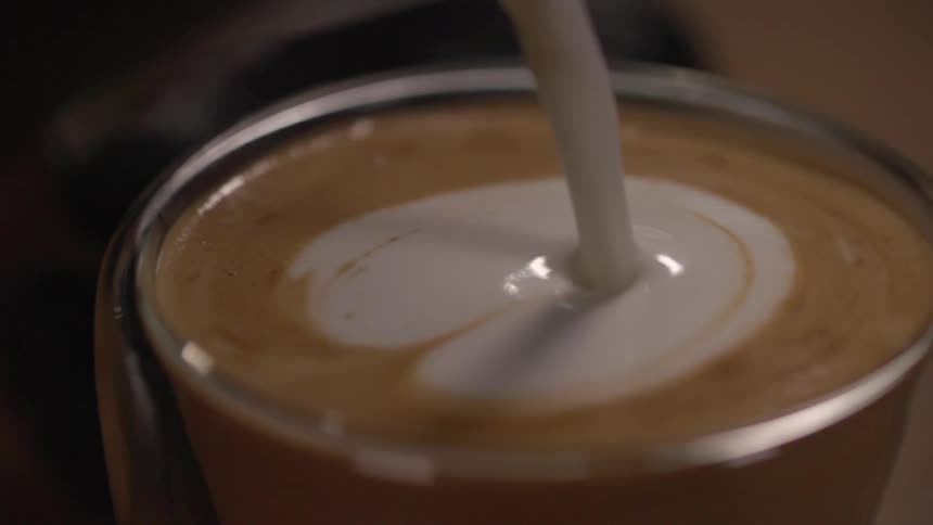 Creating design on top of latte in mug