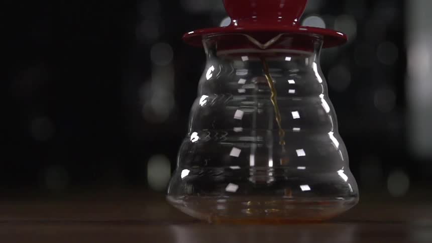 Coffee is being poured into a container
