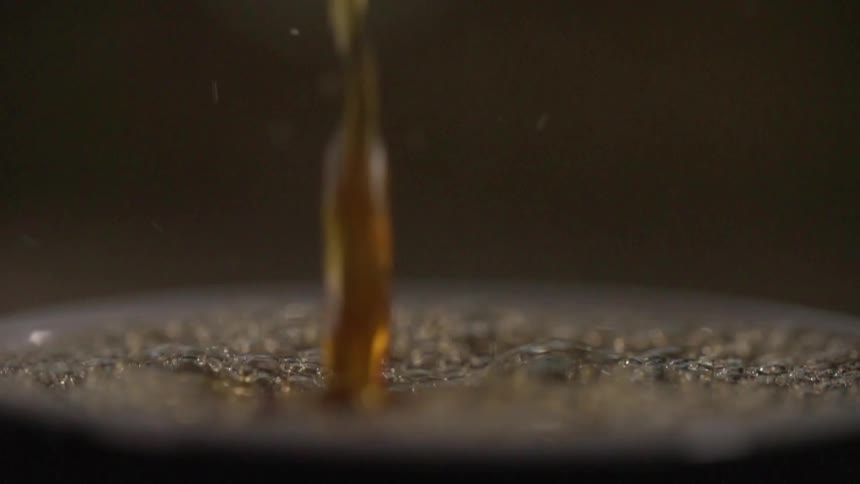 Coffee falling into a cup