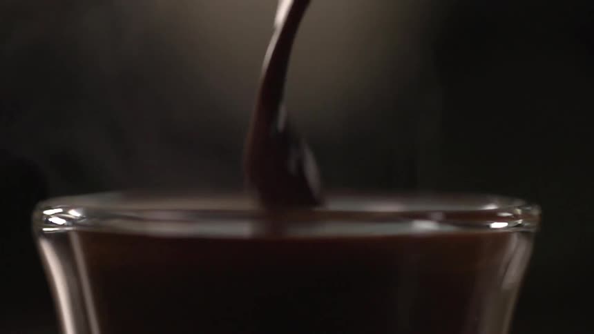 Liquid is being poured into a glass