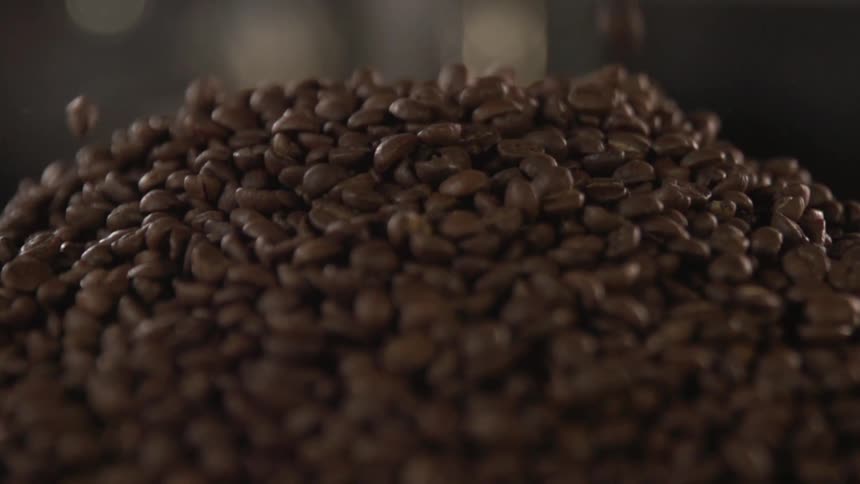 The coffee beans land in a pile