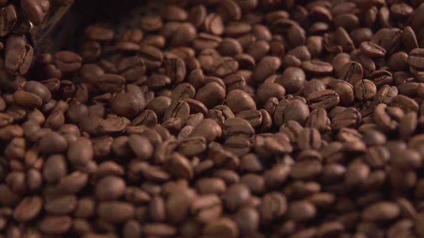 A machine is stirring coffee beans