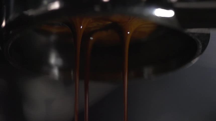 Chocolate drips off of a machine