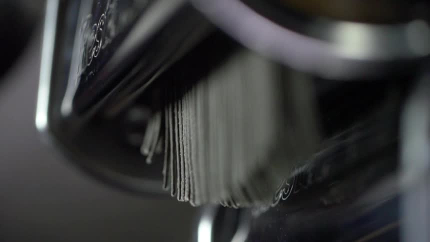 Pasta coming out of pasta making machine