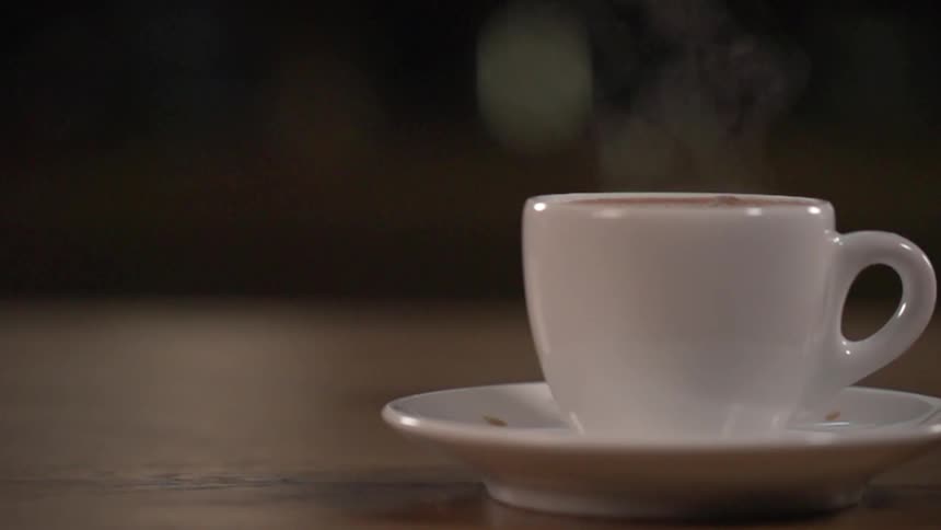 A coffee cup is on a table