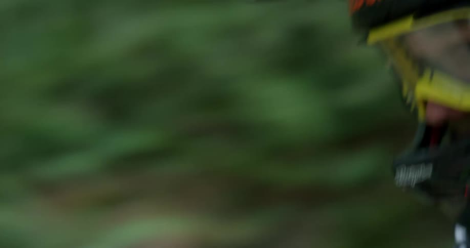Tight Shot of Downhill Mountain Biker Goggles In A Forest At Speed 2
