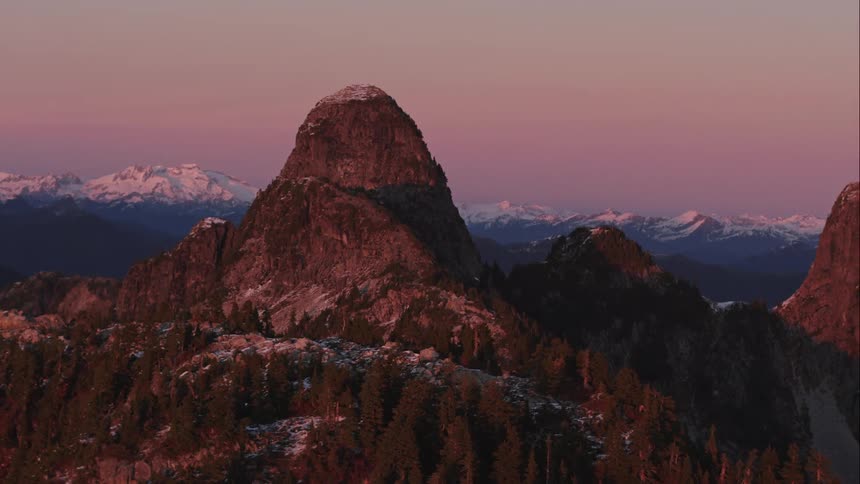 Aerial of The Lions mountain peaks at sunset 4