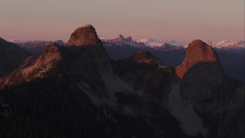 Aerial of The Lions mountain peaks at sunset 3