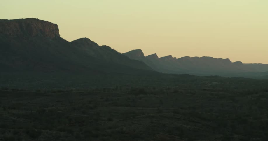 Mountain range sits under a hazy sky