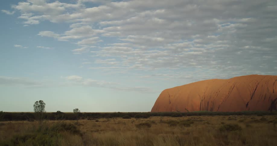 Sunset and clouds on Uluru in Australian Outback