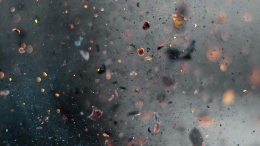 Coal and ashes from a fire blowing in the air