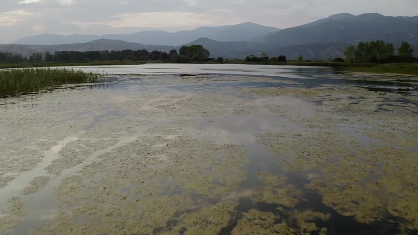 Large lake in front of mountain range