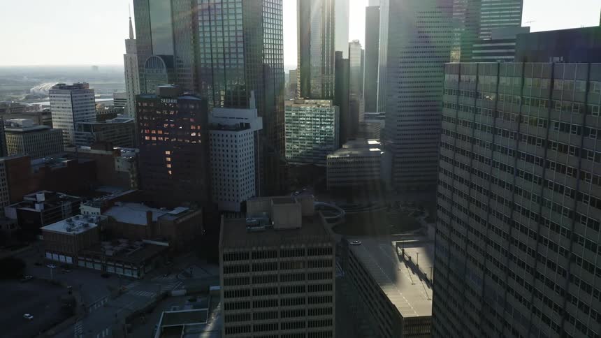 The sunlights hines and glares on city building facades