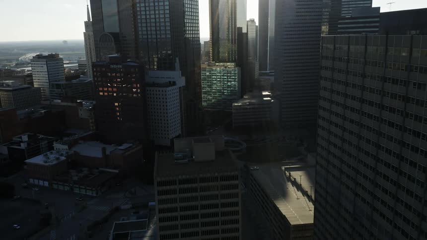 An aerial view of a downtown city is displayed