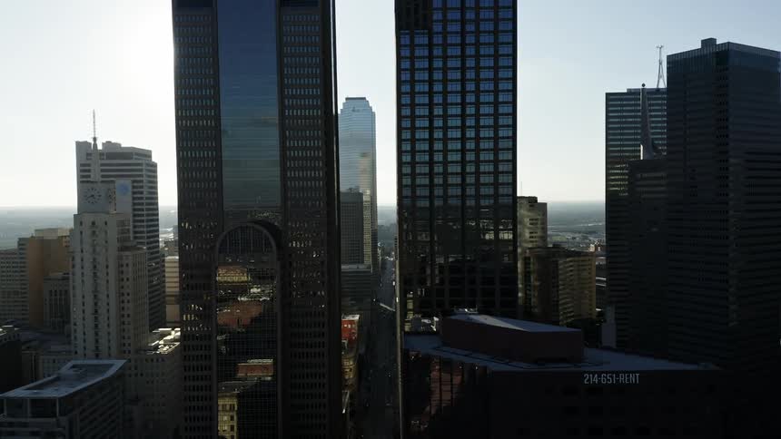 The sun is shining on the downtown city